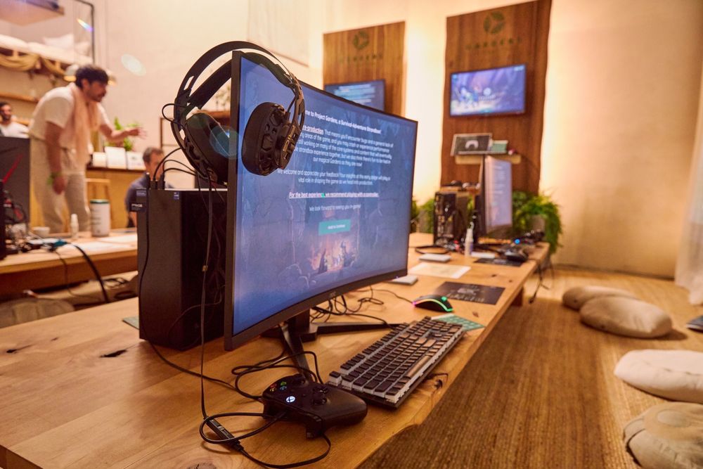 a close-up shot of a PC demo station on top of a low wooden table