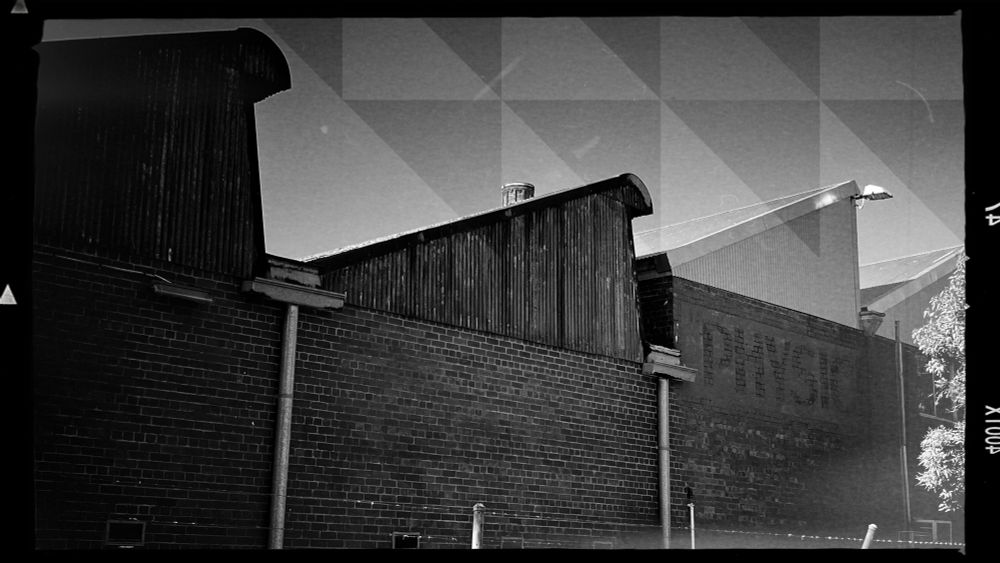 Warehouse rooftops near the river. 