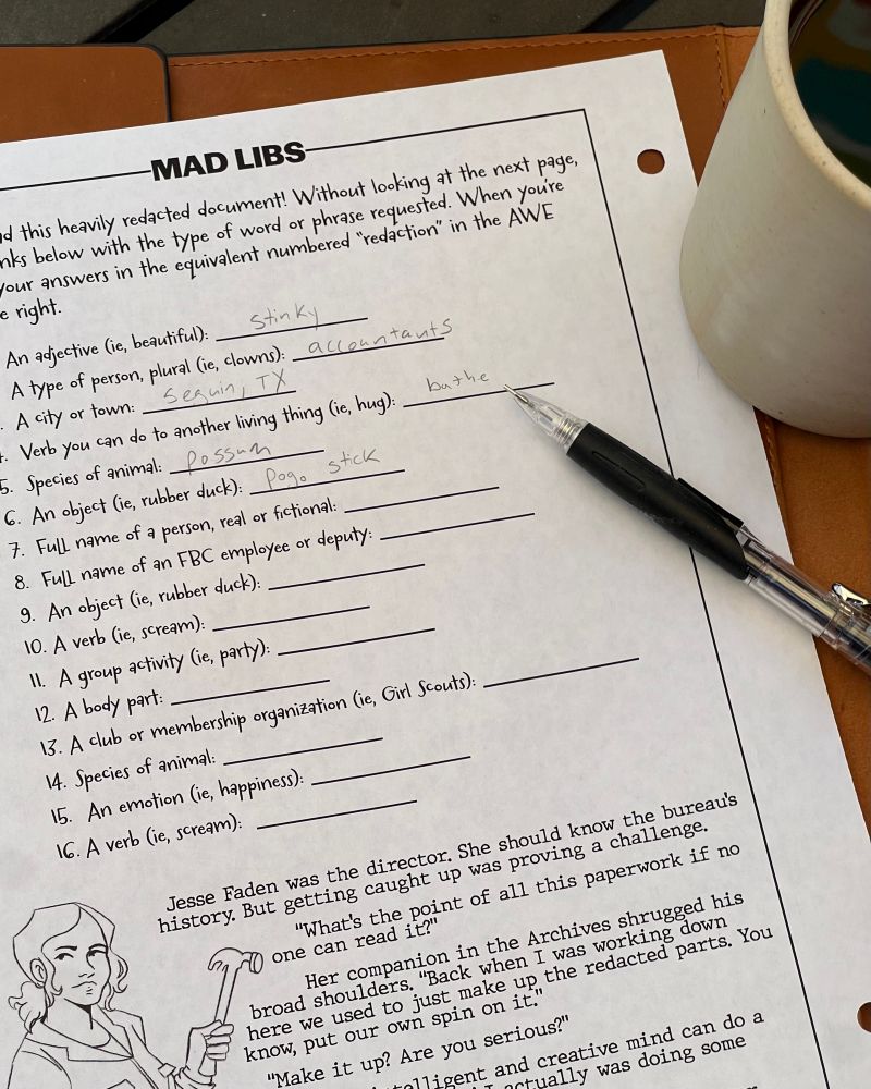 Photograph of an activity book page depicting a MAD LIBS style activity. There are instructions as well as a list of types of words for the user to provide. Below the list is a drawing of Jesse Faden and a partially obscured manuscript snippet. A cup of coffee and a mechanical pencil are on top of the page.