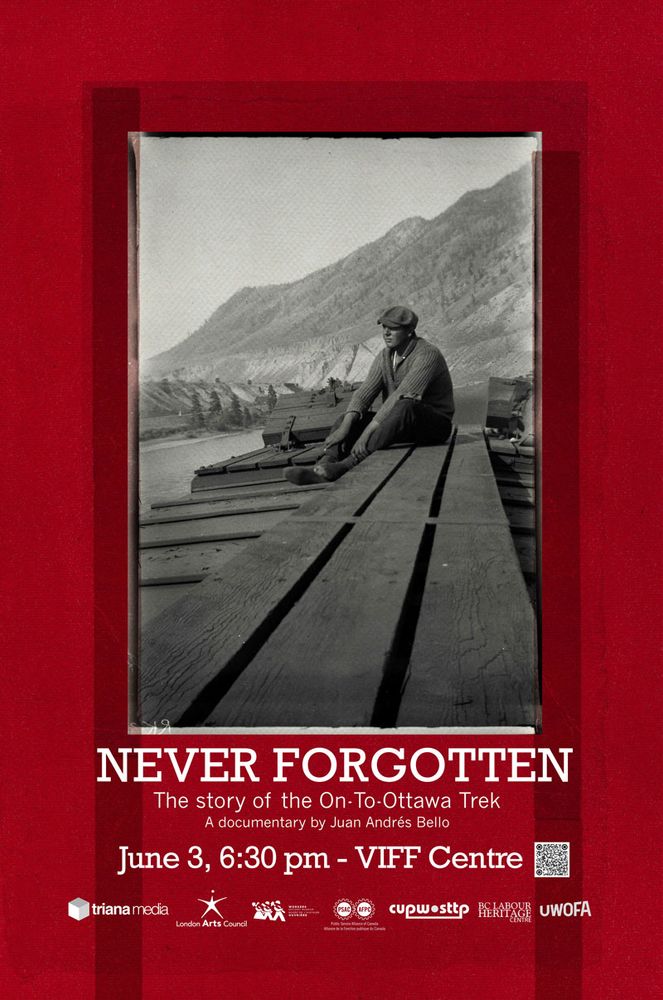 Photograph of man sitting on top of train car
