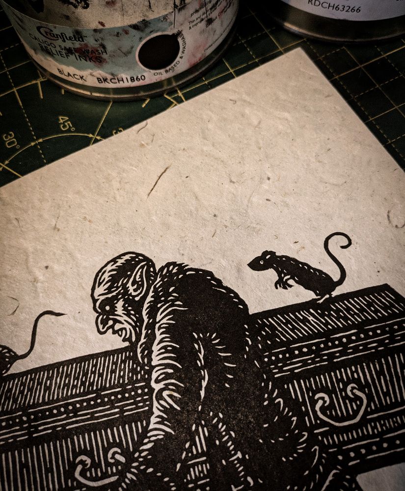 A close-up of the previous lino prints. A pot of printing ink is just visible in the top part of the image.