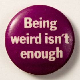 Purple pin with white text that says "Being weird isn't enough"