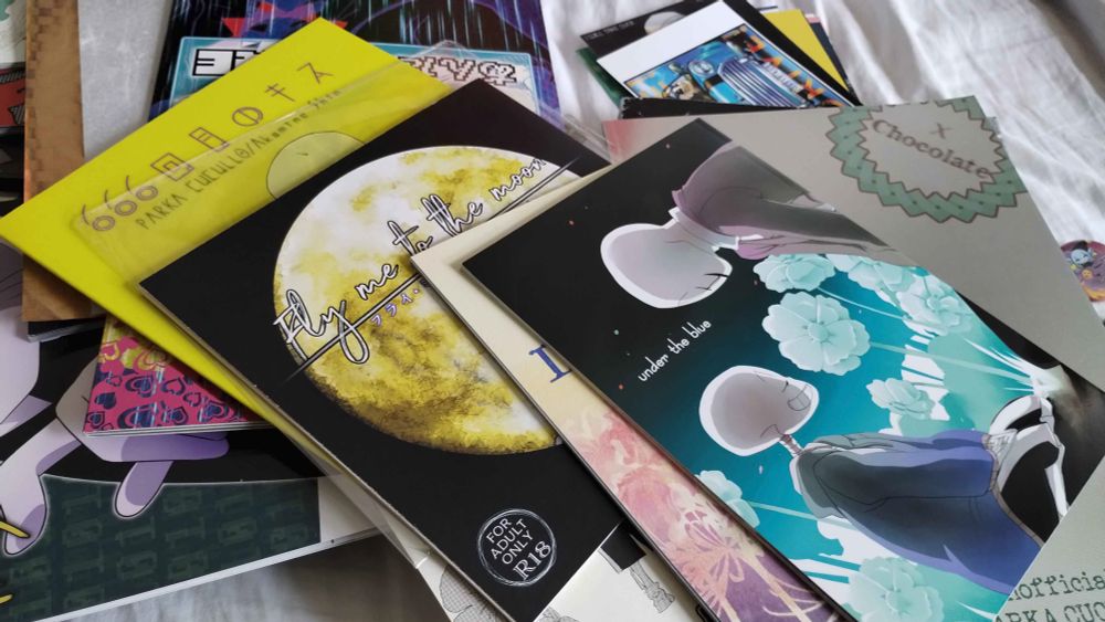 A pile of a variety of Undertale and Deltarune fan merch. Mostly contains Sanster merch