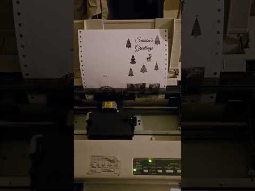 Printing 2024 Pawfee Coffee Christmas Cards on a Star Micronics NX-2420 Rainbow Dot Matrix Printer.