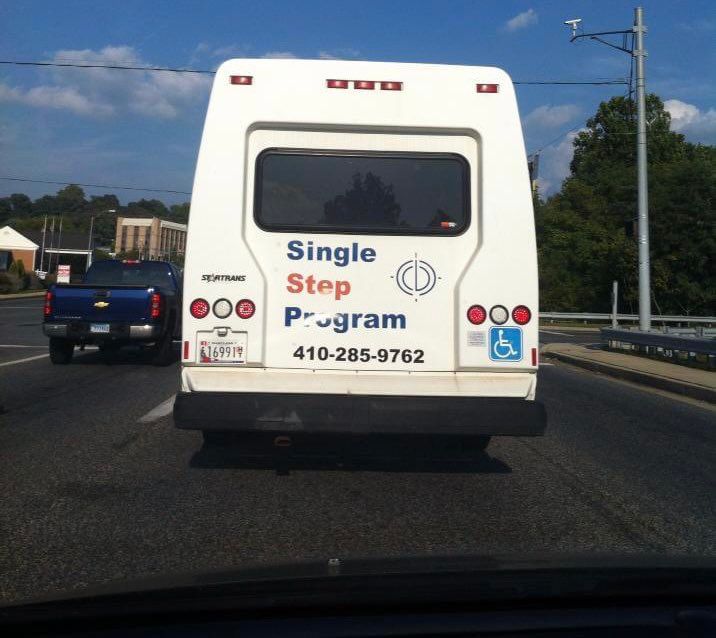 Back of bus says “single step program”
