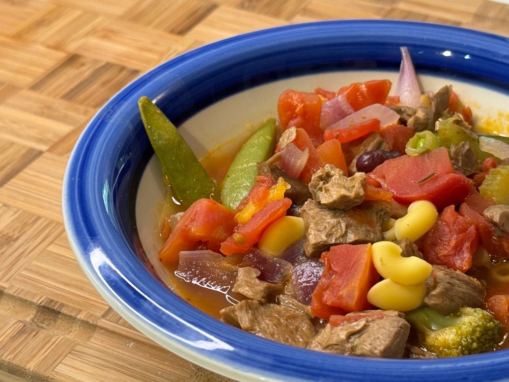 Vegetable stew with plant-based steak tips in a bowl