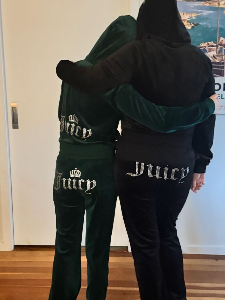 Teenager and Mom stand side by side, facing the wall in matching Juicy Couture tracksuits. Mom going through midlife crisis of sorts. Teen happy to be matchy with Mom for the lols. 