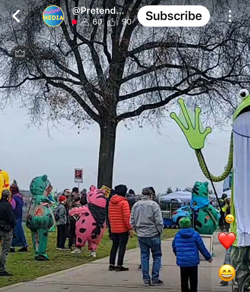 A collection of inflatable frogs and chickens dancing on the waterfront in Portland, Oregon after the March today, Saturday, November 21
