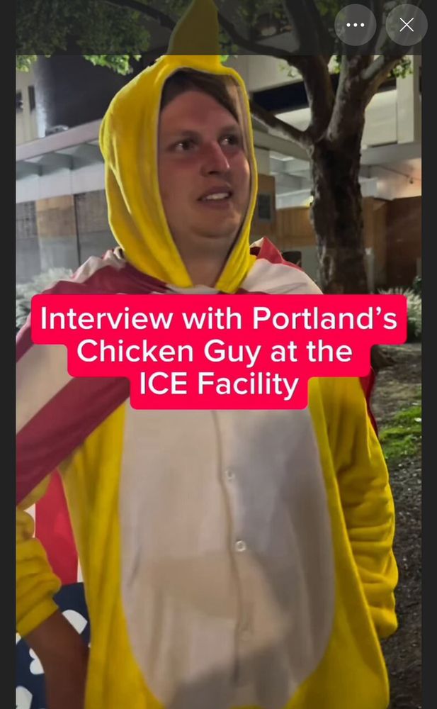 Portland chicken guy in a full chicken costume standing outside of the ice facility in SW Portland, Oregon 