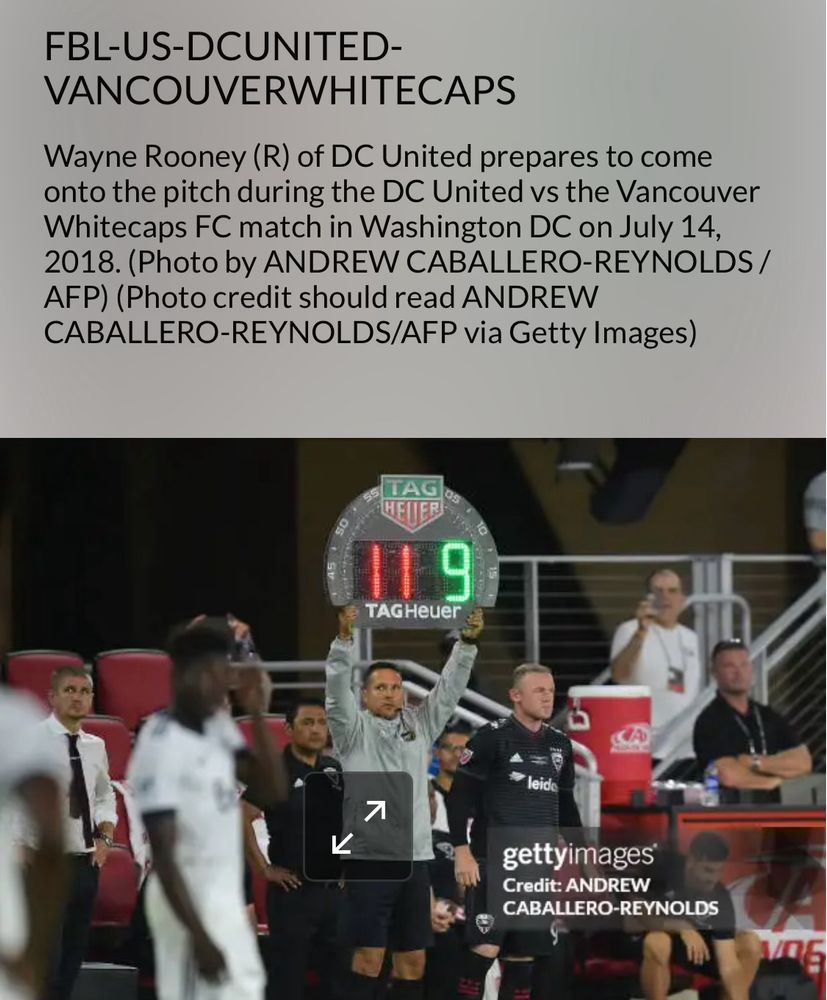 Photo of Vancouver whitecaps soccer team on the field with their coaches and their clear faces over 100 yards from the photographer, Andrew Caballero – Reynolds.