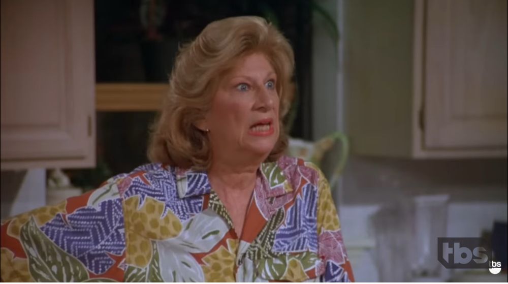 A still from ‘The Pen’ episode of Seinfeld, showing his mother, hand on hip, furious that he took the pen that had been offered to him. 