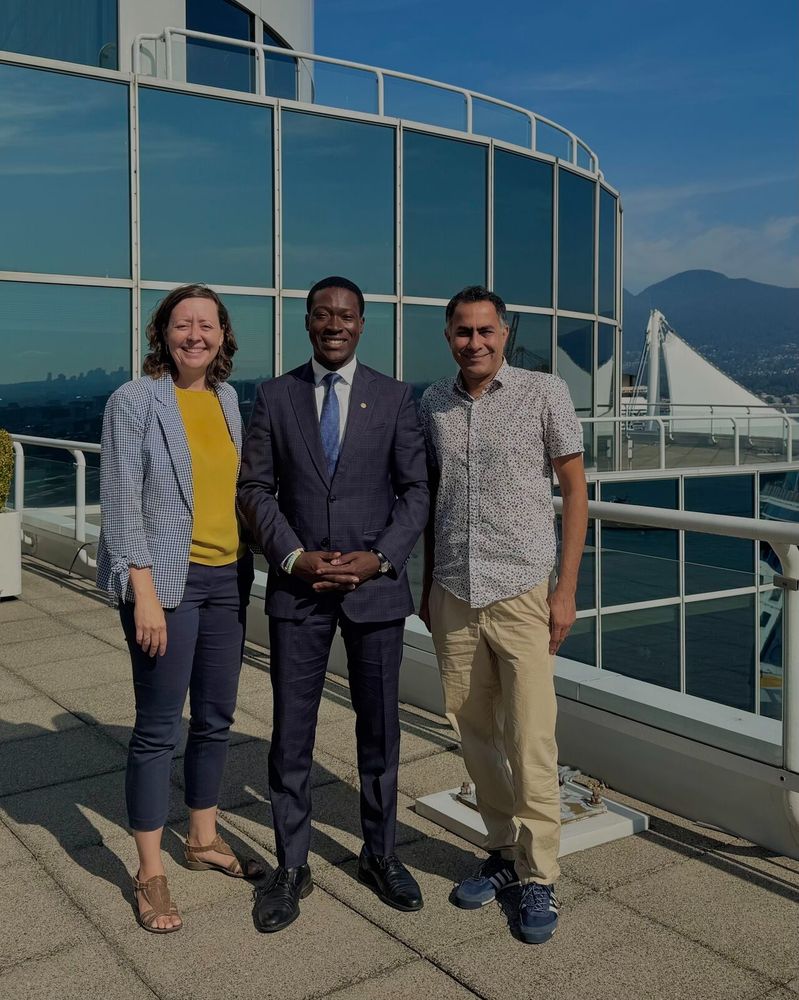 HUB Cycling's Executive Director, Rose Gardner, and Director of Campaigns and Inclusion, Navdeep Singh Chhina ਨਵਦੀਪ ਸਿੰਘ ਛੀਨਾ, and Parliamentary Secretary George Anderson stand together and smile for the camera. 