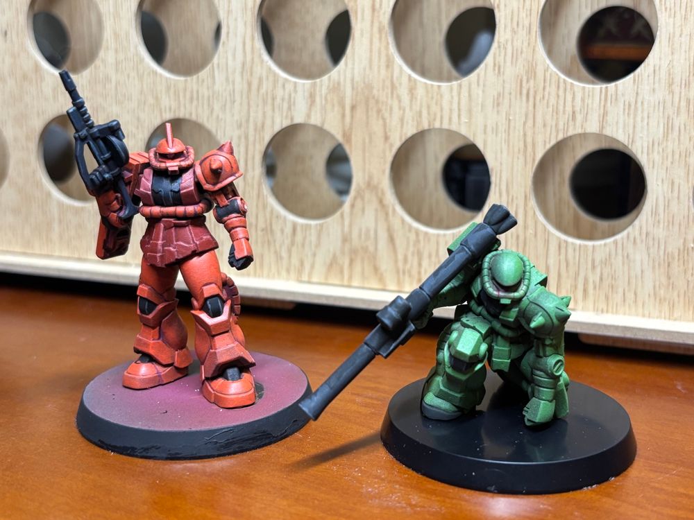 Char’s Zaku II and Zaku II miniatures, painted, from Gundam Assemble