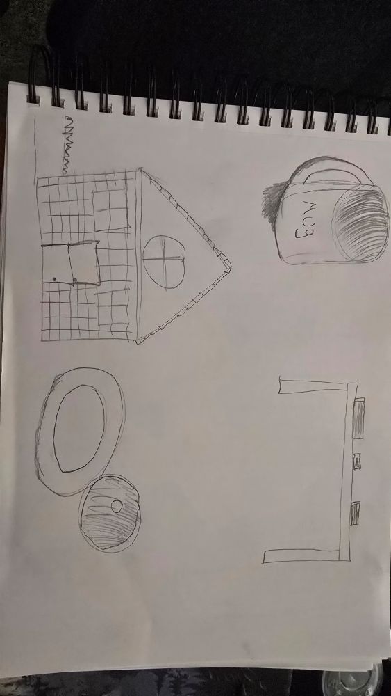 Drawing of a house, a mug, a couple donuts, and a table with books on it done in December 2024
