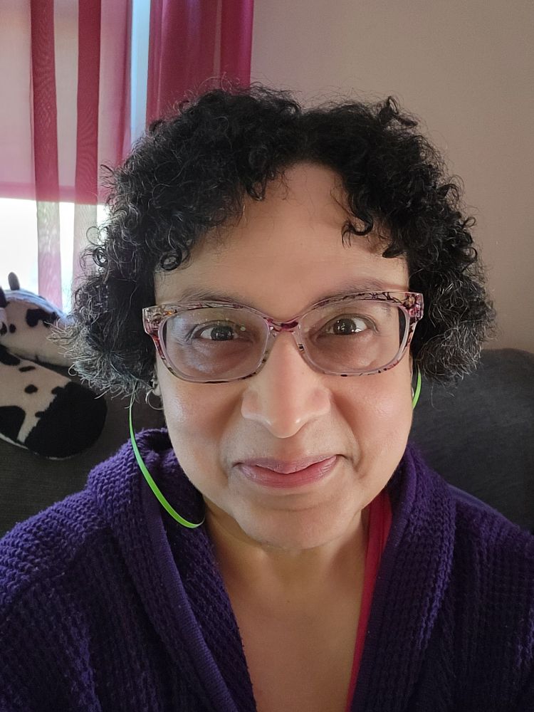 Woman with short hair smiling at camera