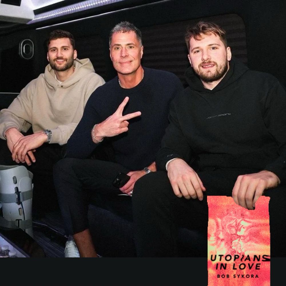 picture of Luka Doncic, Rob Pelinka, and some other guy in a hoodie, Rob is holding up a piece sign and Luka Docic has a copy of my book Utopians in Love! 