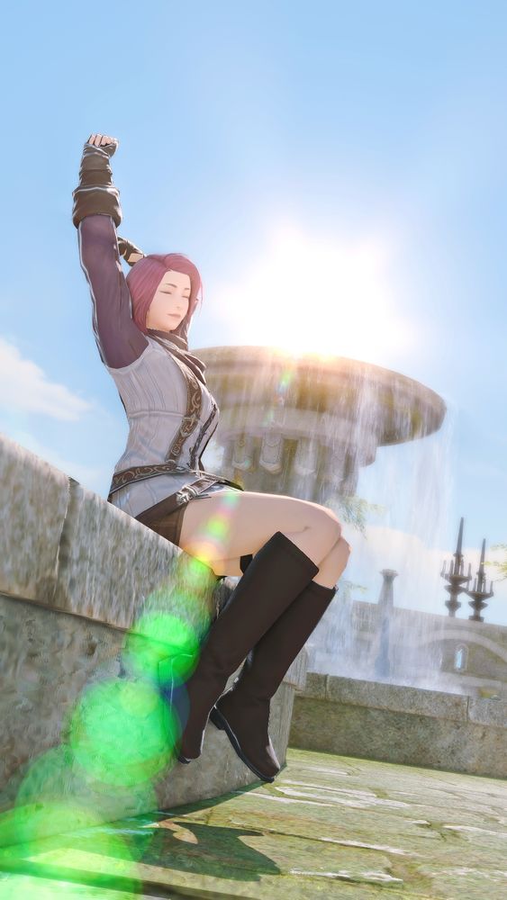 A character with short pink hair and a white and purple tunic sits on a stone wall, stretching with their arms raised and eyes closed. Sunlight and a large fountain are in the background.