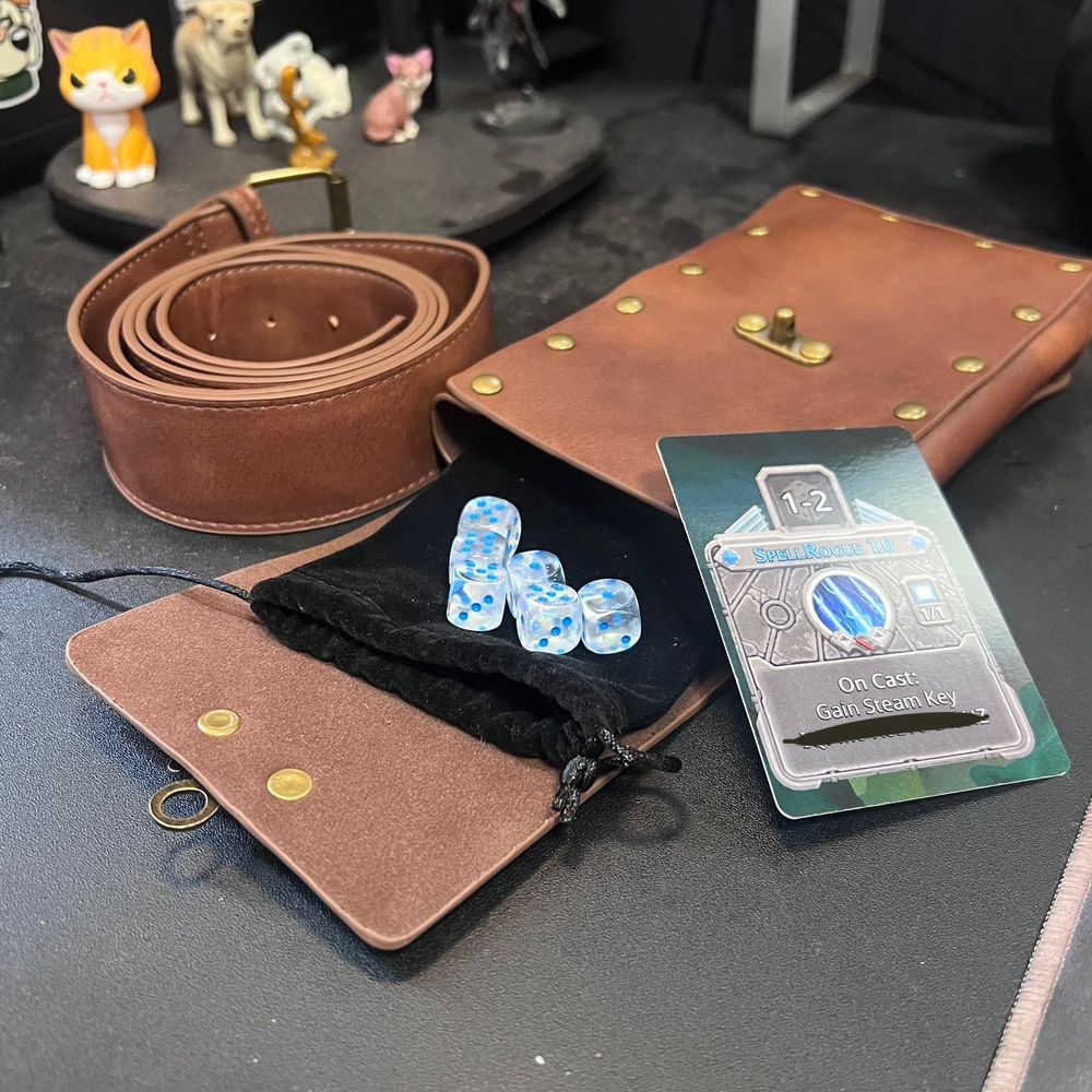 A press kit for SpellRogue featuring a leather belt & pouch with dice poking out.