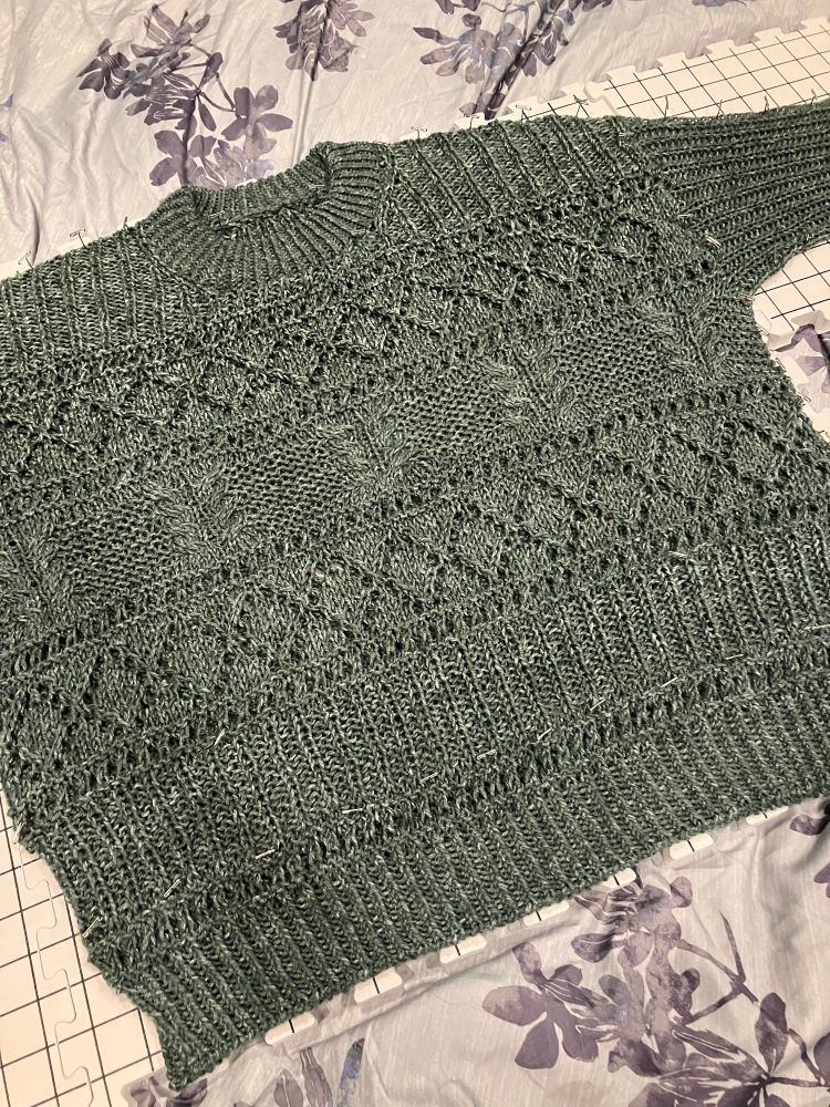 A gray Salty Days sweater, pattern by Veronika Lindberg, knit with Lion brand Jeans yarn, pinned on blocking mats to ensure a boxy drapey fit. 