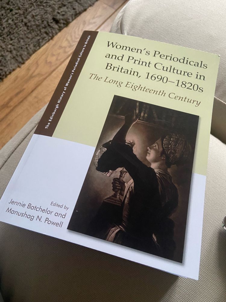A yellow and brown book cover featuring the book title and an engraving of a woman reaching for book by candlelight