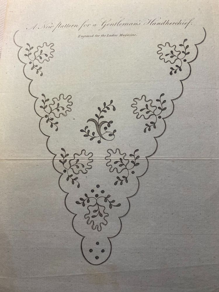 A scalloped edged, triangular design for a gentleman's neck handkerchief featuring stylised leaves.