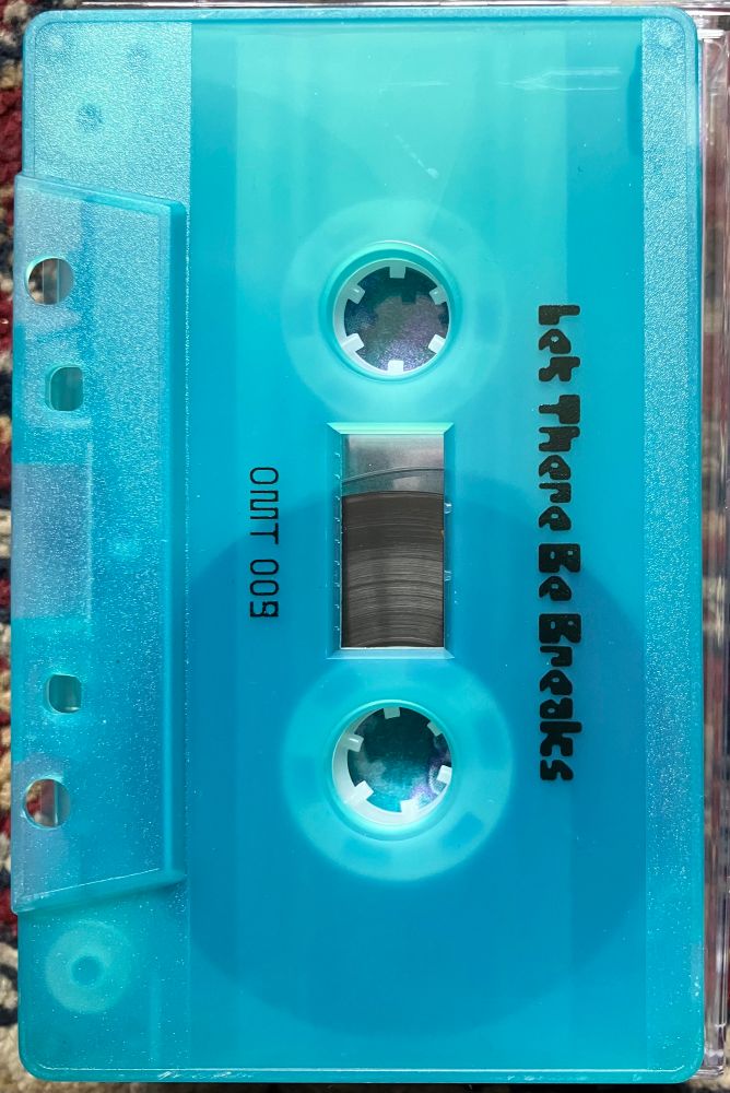 Side B
Aqua blue cassette with black lettering 
Let There Be Breaks
OMT 009