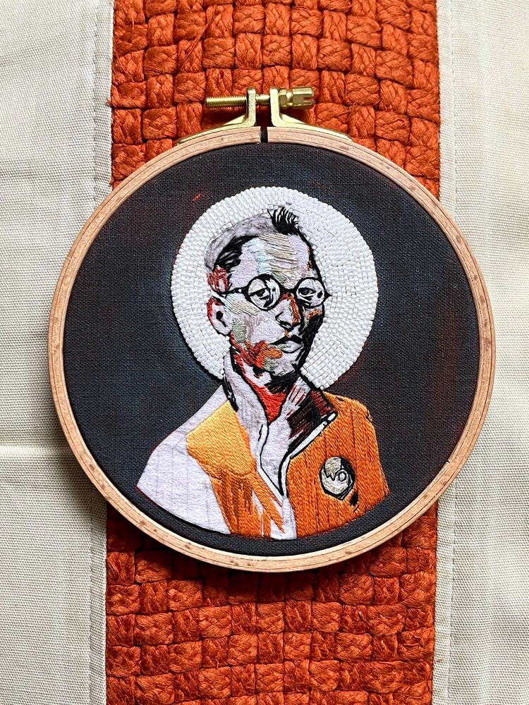 Work in progress embroidery of Kim Kitsuragi from Disco Elysium.