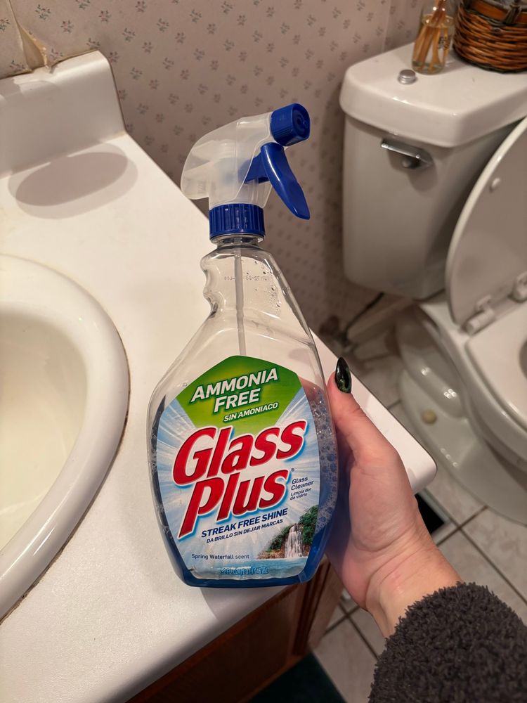 A bottle of Glass Plus cleaner. 