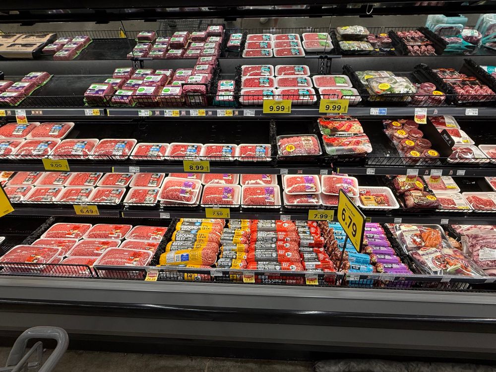 Meat case at grocery store showing the crazy high prices $$ for ground beef -$9.99 lb 👎
