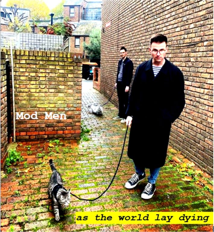 Photo of two young men walking cats in a bricked courtyard alley. The color has been saturated and titles added: Mod Men  As the World Lay Dying