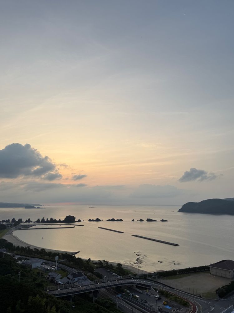 Kushimoto, with the Hashiguiiwa backlit by the sunrise.