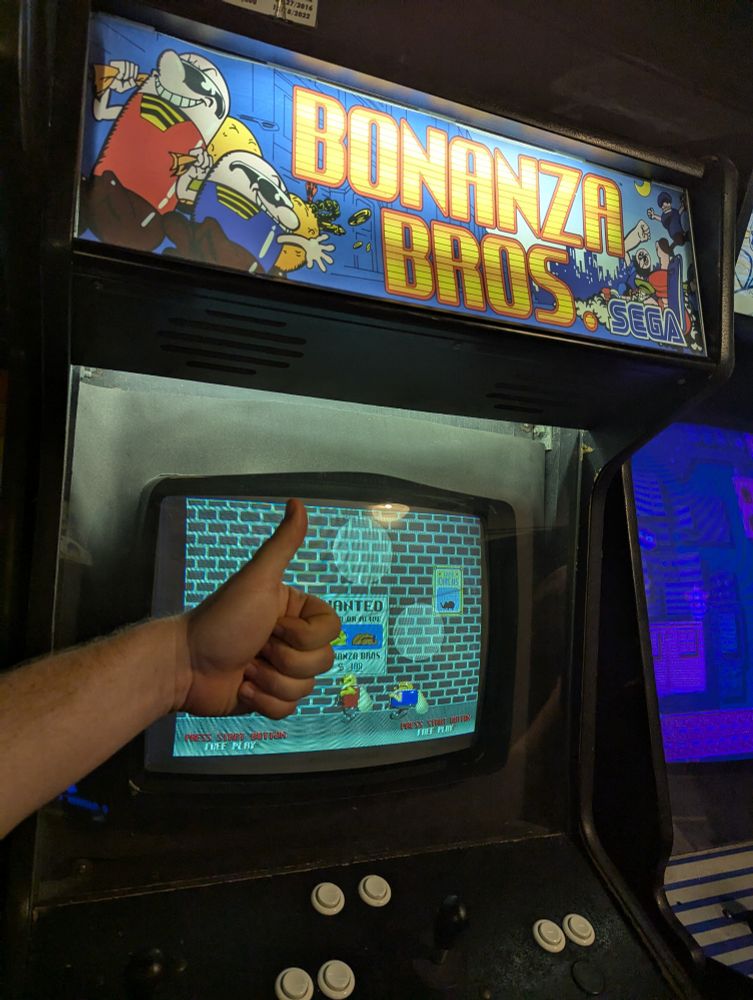 Thumbs up in front of the hot new video game Bonanza Bros, an arcade machine at Galloping Ghost.