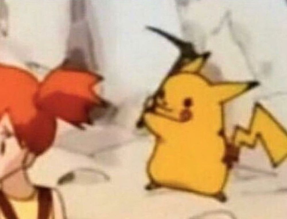 Pikachu raising pickaxe behind Misty/Kasumi