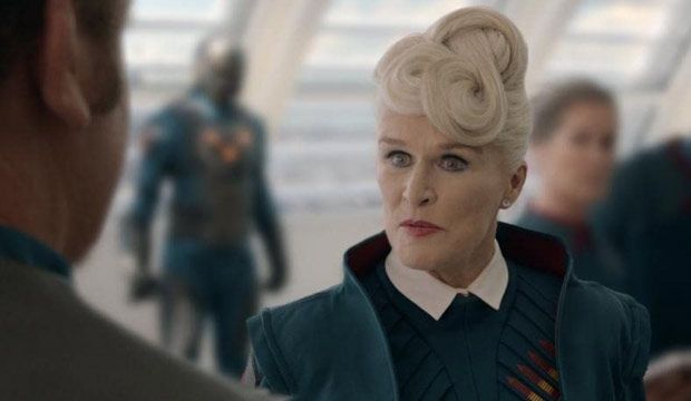 Glenn Close in a cameo role for "Guardians of the Galaxy", dressed in a teal coat with "scifi-appropriate" structured collar and lapels white collar, and what looks like a vented teal suit. She sports what looks like a futuristic and chic twisted take on a French roll. She called someone a prick in this movie.