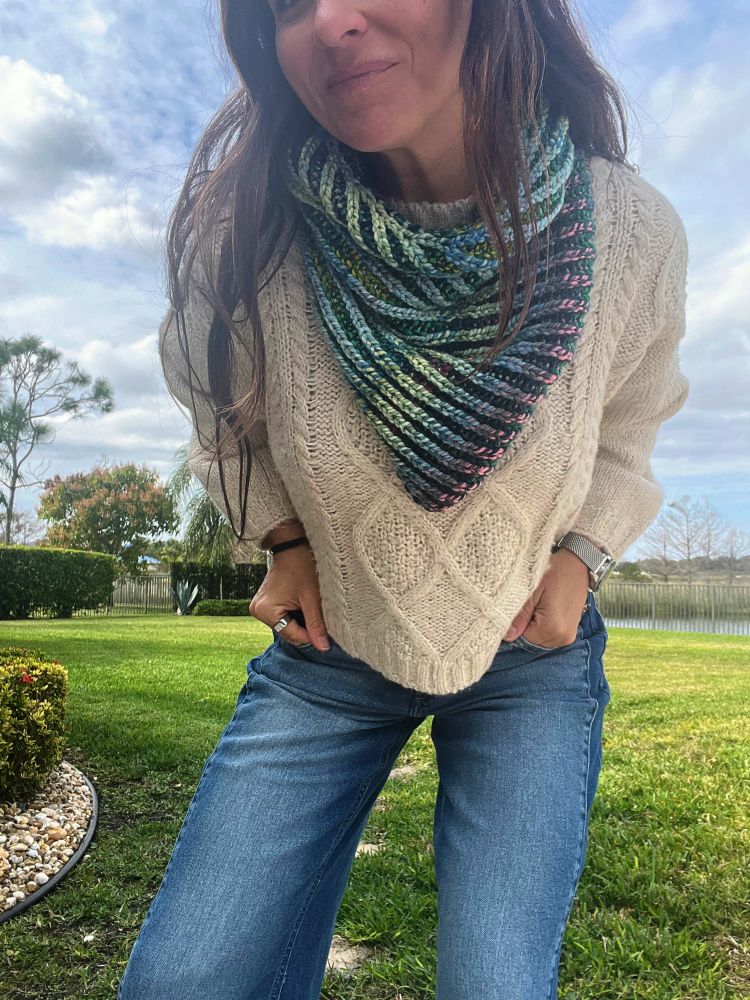An image of me in jeans and a sweater wearing by hand knit 2 color brioche cowl 