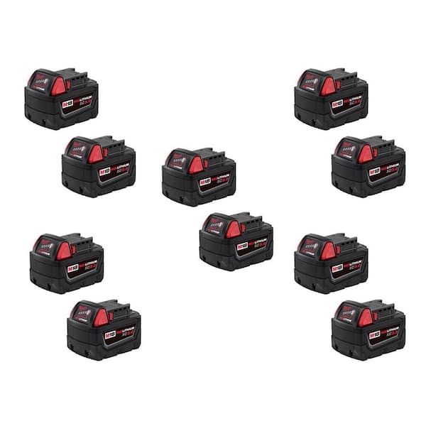 Ten Milwaukee 18v tool batteries randomly scattered across a white background.