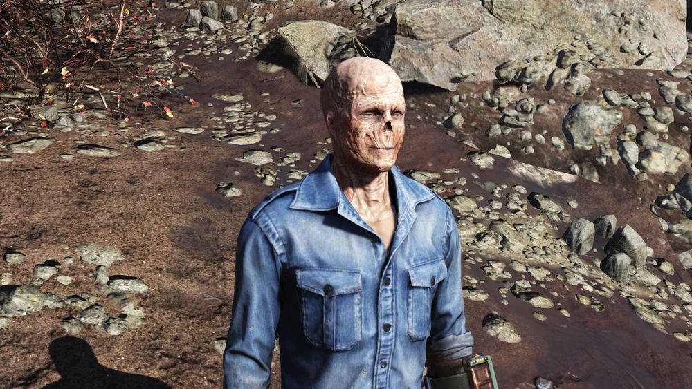 A smiling ghoul is wearing a denim jacket and pants, also known as a 'Canadian Tuxedo'.