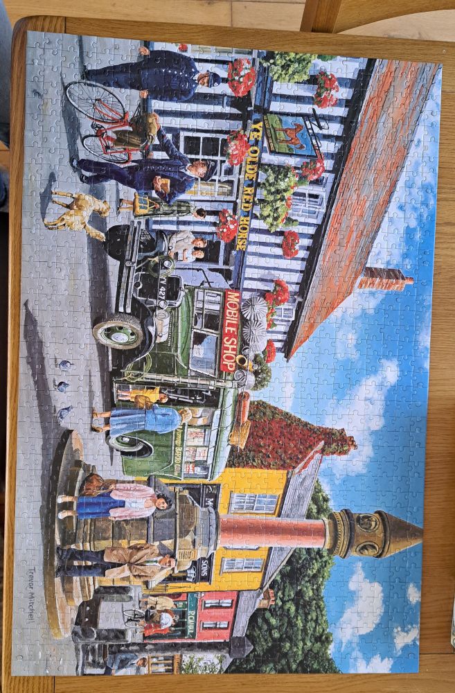 Completed jigsaw of a village marketplace