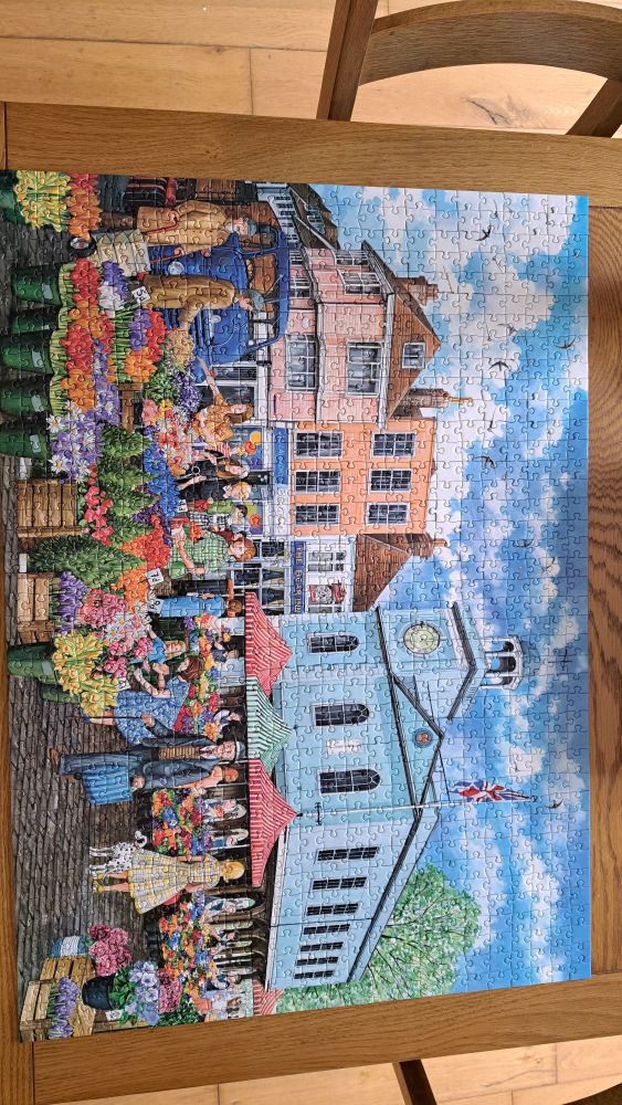 Completed jigsaw of a flower market