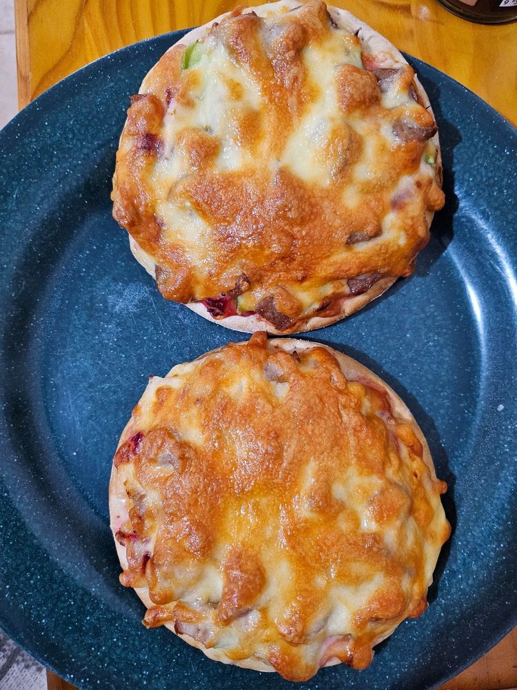 Finished pizzas, golden brown