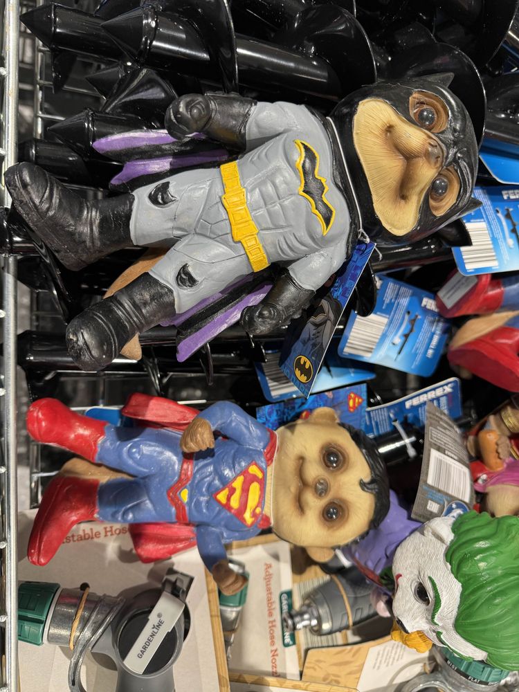 A close up of two of the DC Superhero meercats. Batmeercat and Supermeercat, wearing Batman and Superman outfits.

Yes, they are as weird as this description makes them sound.