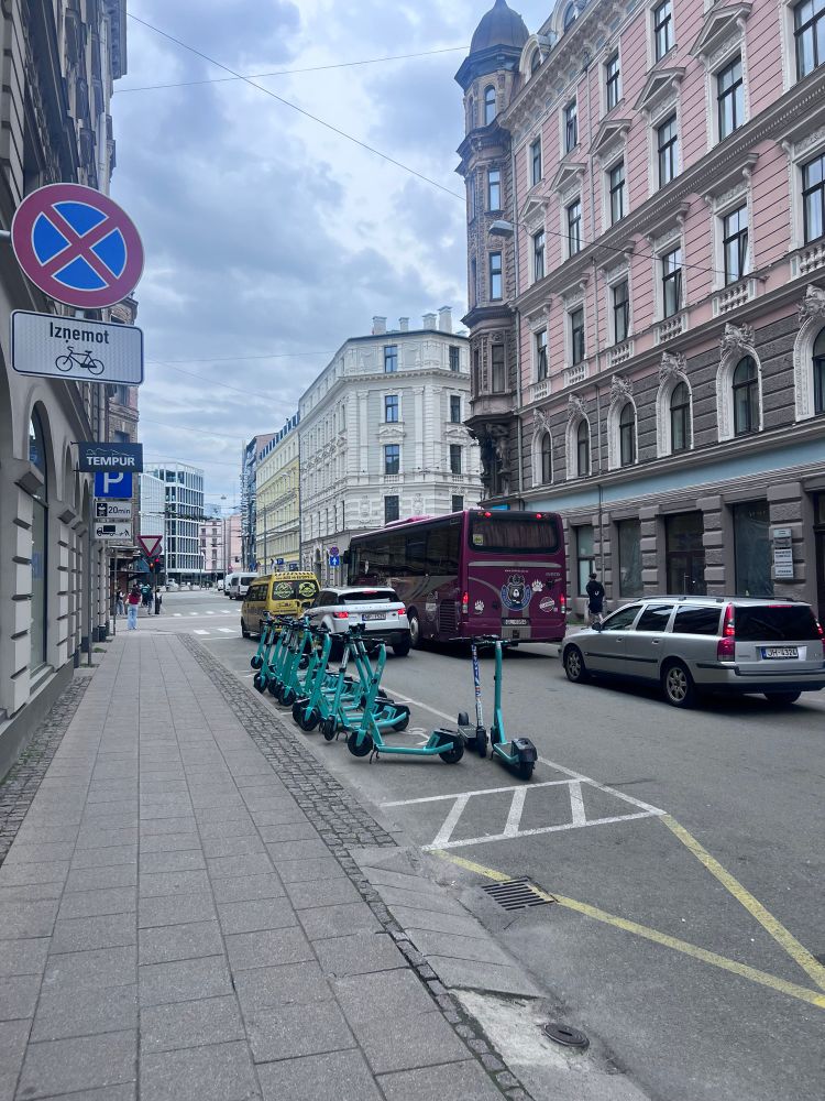 Dedicated bike share parking space painted on the road, not on sidewalk, in Riga 