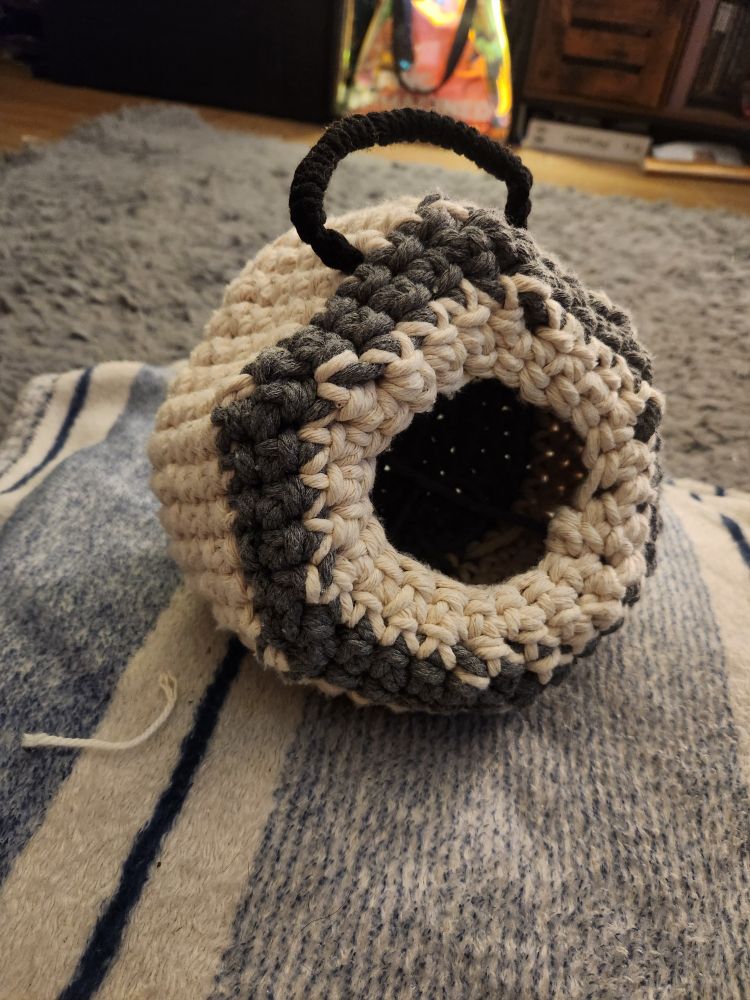 A white and grey hanging hidey hole for the rat cage, crocheted with 6mm macrame cord