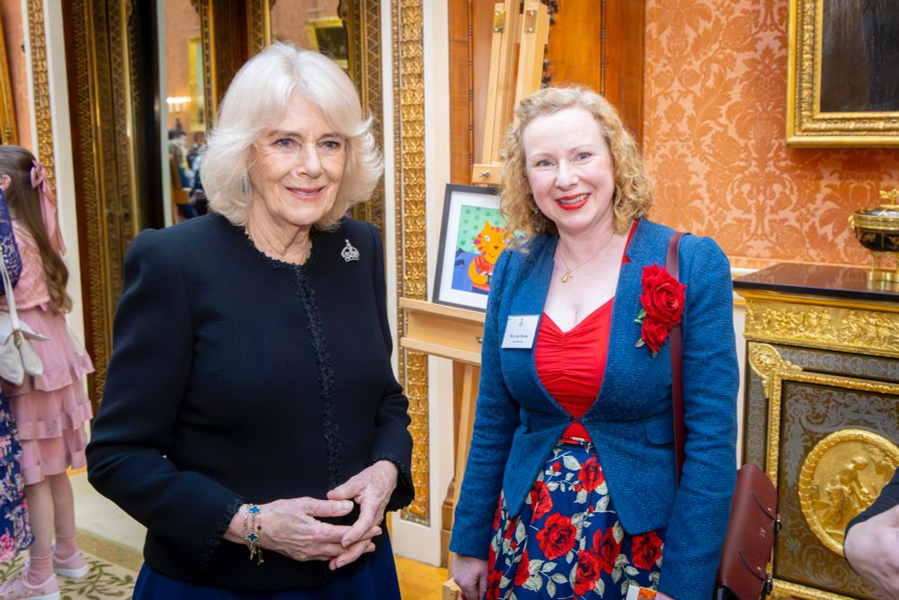 Lydia meeting Queen Camilla at Buckingham Palace. 