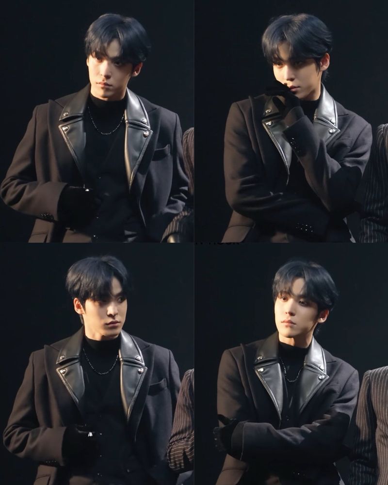 ateez yunho looking handsome in a black coat and turtleneck while filming
