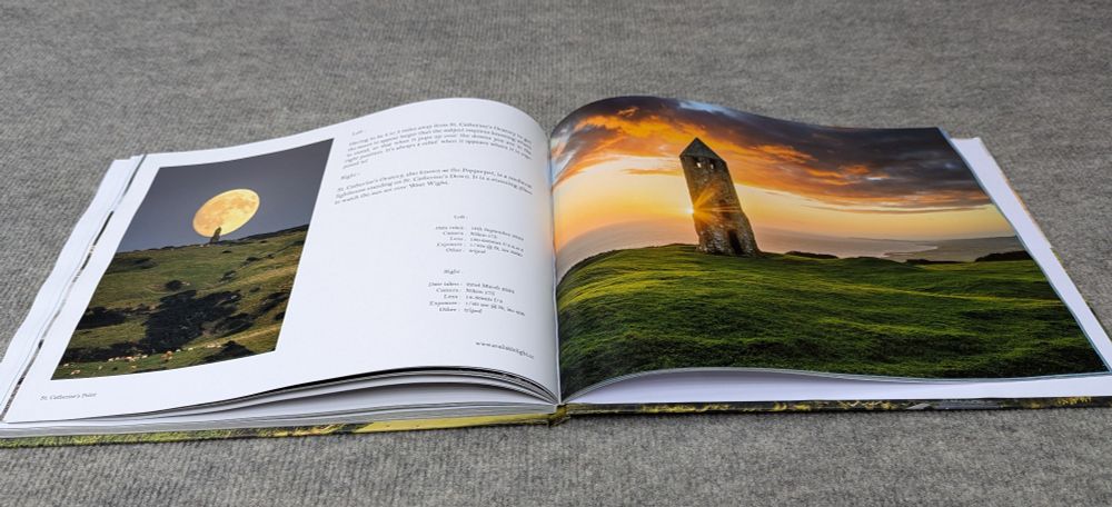 The inside of the book featuring 2 landscape photographs 