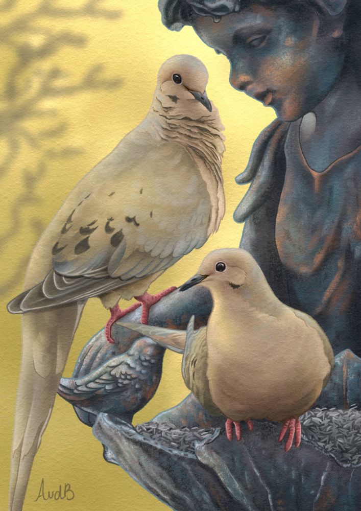 Mourning doves sitting on a bronze statue
