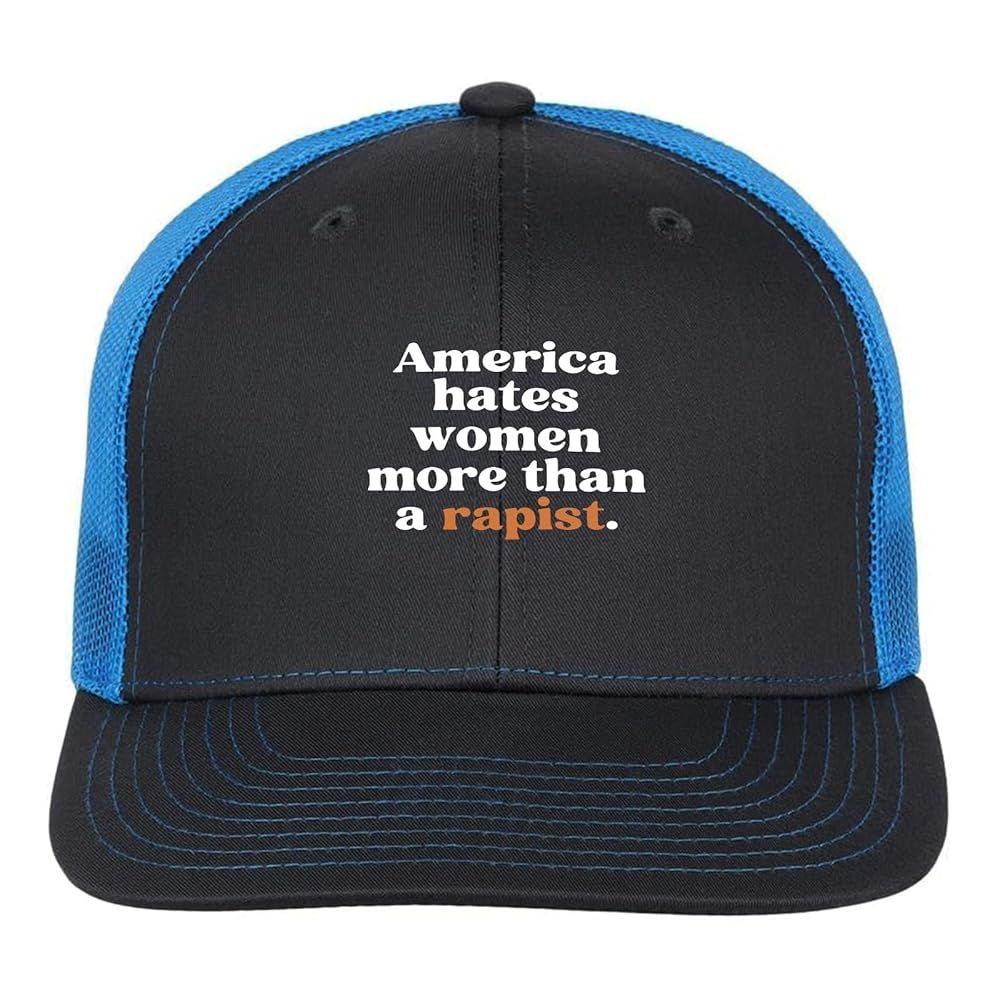 America hates women more than a rapist. Black logo cap with blue accents The word ‘rapist’ appears in orange letters to refer to DJT.