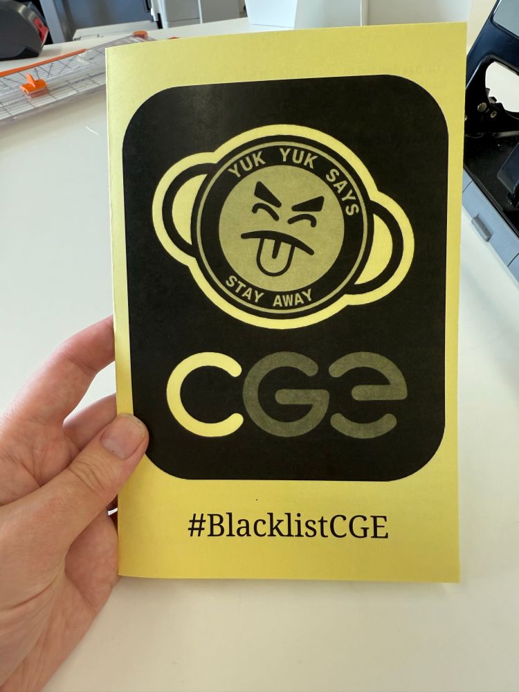 A zine printed on yellow paper with a Mr Yuk that looks like the CGE logo. The logo around it says “Yuk Yuk Says Stay Away” with the CGE letters below it.

Below that, a hashtag: #BlacklistCGE