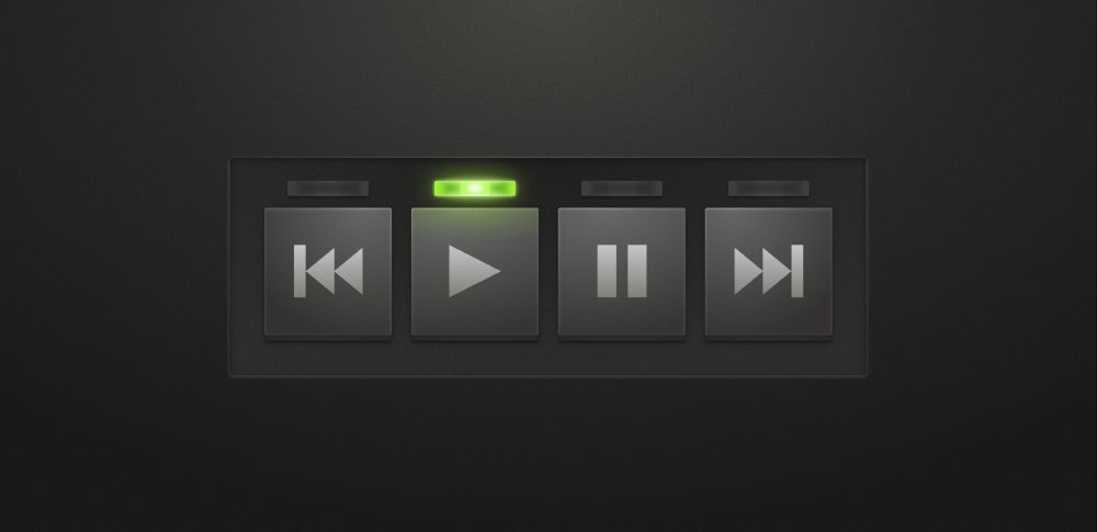 Skeuomorphic rendering of 4 buttons: back, play, pause, next. Each button has a thin indicator light above. The play button's indicator light is lit. All of the aforementioned elements are within a matte background